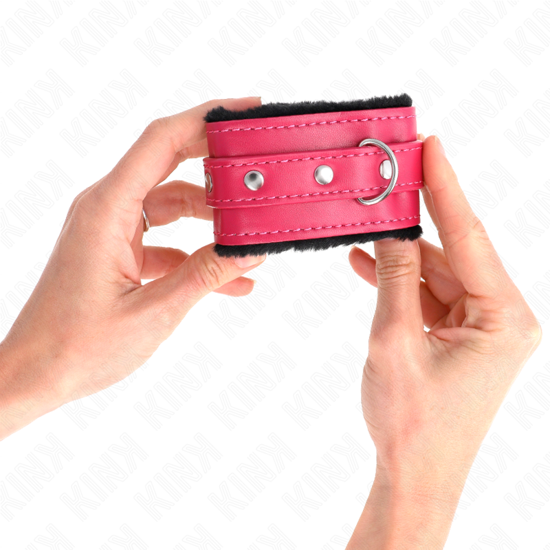 KINK - APPUI-POIGNETS DOUBLÉS DE FOURRURE PREMIUM NOIR AVEC CEINTURE ROSE FRAMBOISE AJUSTABLE 17-29 CM X 6 CM KINK WRIST RESTRAINT