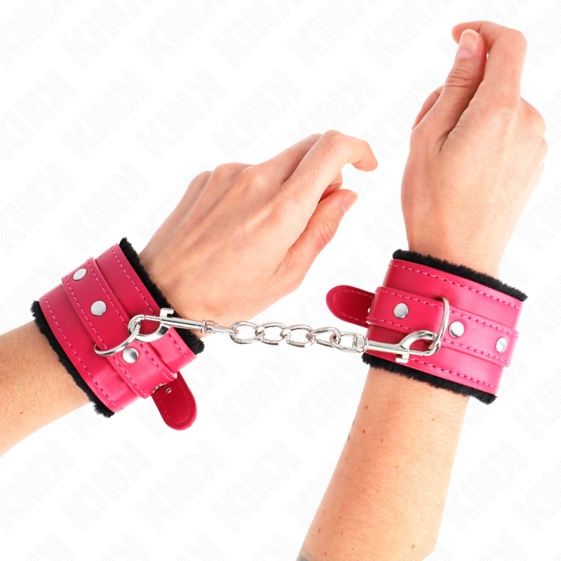 KINK - APPUI-POIGNETS DOUBLÉS DE FOURRURE PREMIUM NOIR AVEC CEINTURE ROSE FRAMBOISE AJUSTABLE 17-29 CM X 6 CM KINK WRIST RESTRAINT
