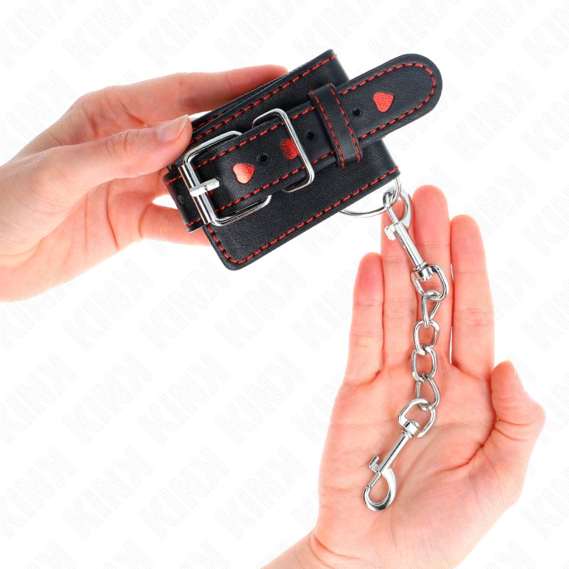 KINK - APPUI-POIGNETS NOIR AVEC INCRUSTATION COEUR ROUGE RÉGLABLE 21-28 CM X 5,5 CM KINK WRIST RESTRAINT